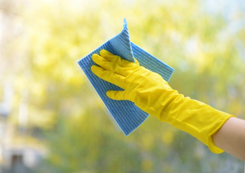 Cleaning team preparing a safe deep cleaning site with protective equipment