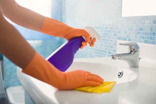 Technician checking cleaning equipment before use