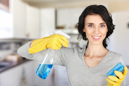 Local oven cleaner working in a Deep kitchen with careful deep clean tools