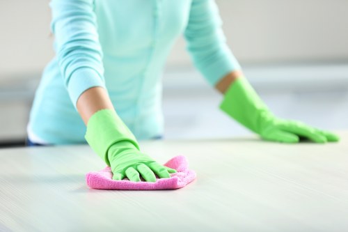 Cleaner wearing PPE during a professional deep clean