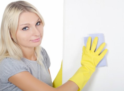 Careful cleaning of overlooked bathroom areas in a deep cleaning routine