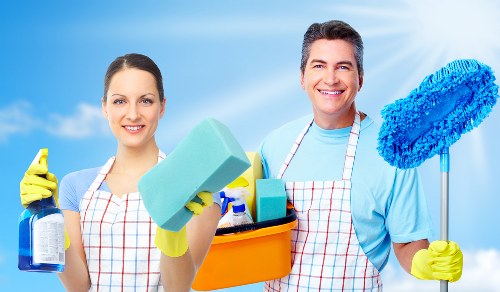 Detailed cleaning of hidden kitchen surfaces during a deep deep clean