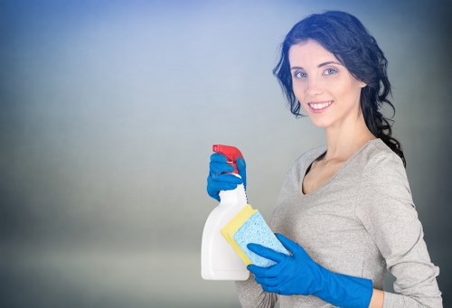 Office cleaners in Deep preparing a workplace for routine maintenance cleaning